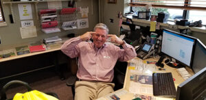 Photograph of Jim Reilly at His Desk