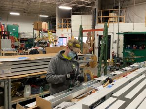 Photograph of woman working in warehouse